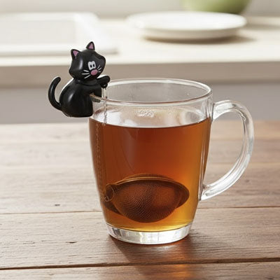 Boule a the avec motif chat dans un verre the